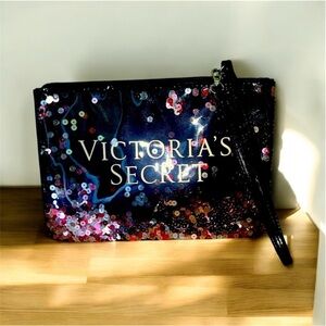 Victoria’s Secret Black Wristlet With Red and Silver Movable Sparkling Designs